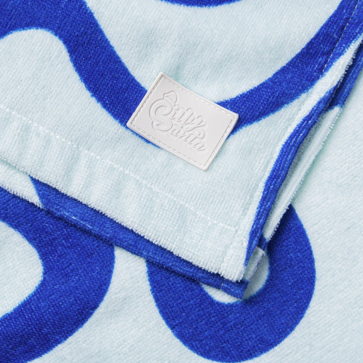 Poncho de bain enfant - bleu à motif ondulé